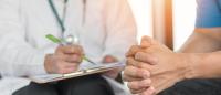 doctor talking with patient